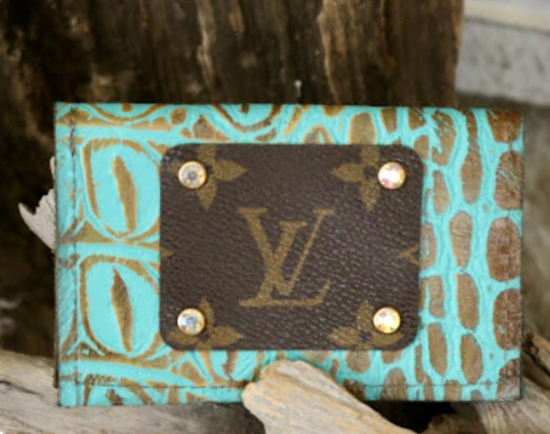 Turquoise crocodile leather business card holder with LV logo