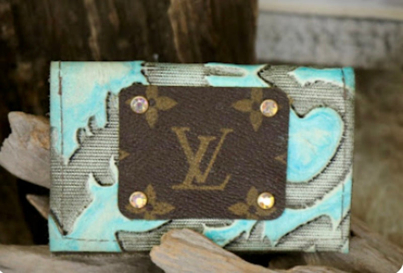 Turquoise leather business card holder with LV logo