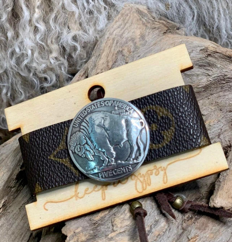 Louis Vuitton cuff with buffalo coin